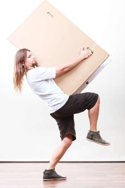 Delivery man holding a paper box. - Foto, Imagem