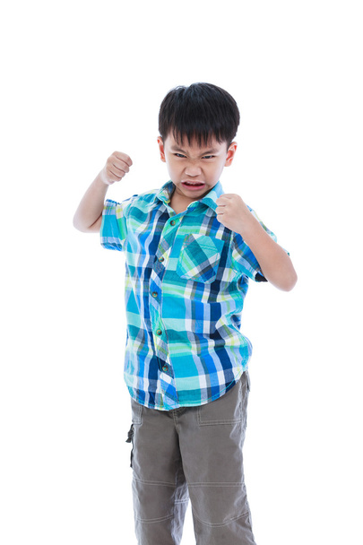 An Aggressive Asian Child. Boy Looking Furious. Negative Human Face Expressions Concept. - Photo, Image