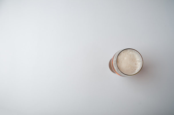 Glass of light beer isolated on a white background - Фото, зображення
