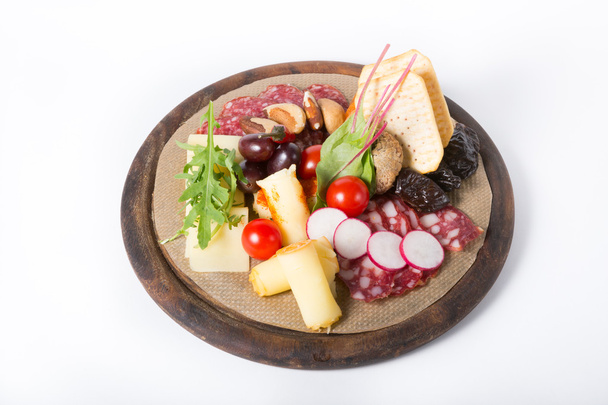 Wine snack on a wooden board - Фото, зображення