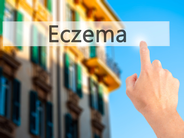 Eczema - Hand pressing a button on blurred background concept on - Photo, Image