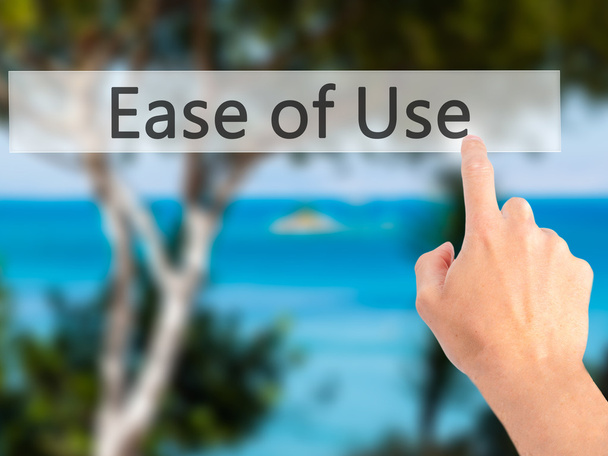 Ease of Use - Hand pressing a button on blurred background conce - Photo, Image
