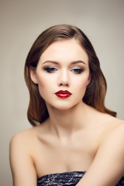 Classic red lips girl looking down - Photo, Image