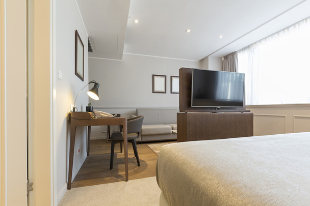 Modern bedroom interior in hotel apartment - Φωτογραφία, εικόνα