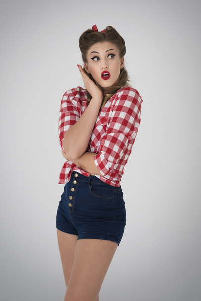 Shocked pin up girl looking up  - 写真・画像