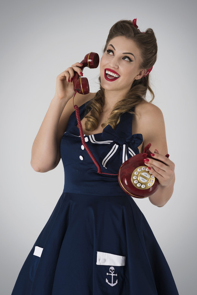 Pin up girl talking on telephone  - Foto, afbeelding