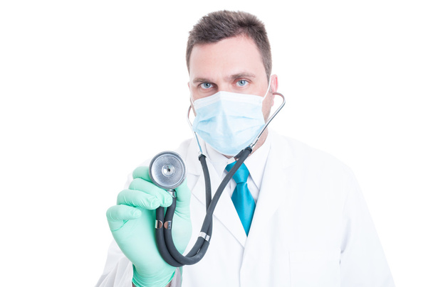 Male doctor holding stethoscope like consulting - Φωτογραφία, εικόνα
