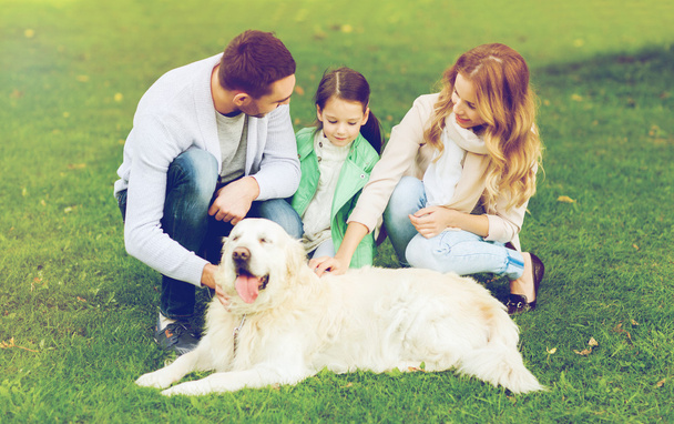 happy family with labrador retriever dog  - Zdjęcie, obraz