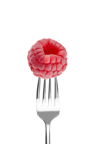 Fresh big raspberry on a fork - Foto, Bild