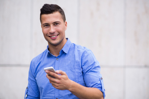 Young man with smartphone  - Photo, Image