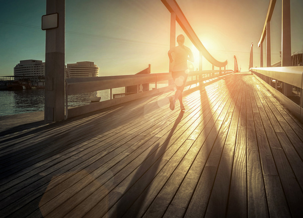 Woman running on the bridge - Foto, Imagem