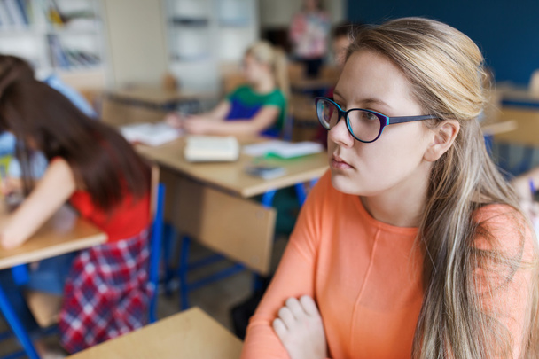 student girl in eyeglasses at school lesson - Photo, Image