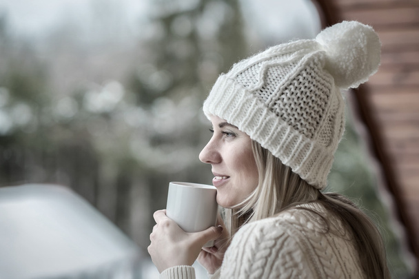 Female with cup of coffee at winter - Zdjęcie, obraz