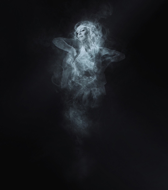 Dancer from smoke on dark - Foto, Imagen