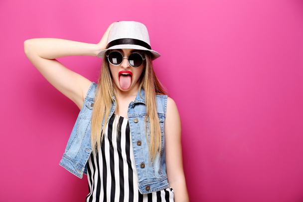 hipster girl shows tongue  - Fotografie, Obrázek