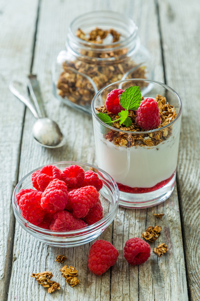 Granola with rasberry and yogurt in glass - Foto, immagini