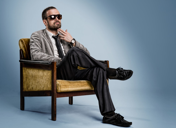 bearded man sitting on a chair - Fotografie, Obrázek