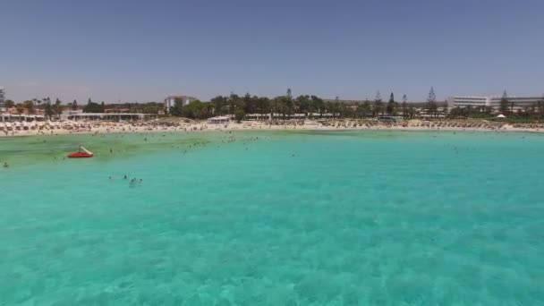 AGIA NAPA, CYPRUS - JUNE 2016 - Aerial view of Nissi beach with vacationers - Filmmaterial, Video