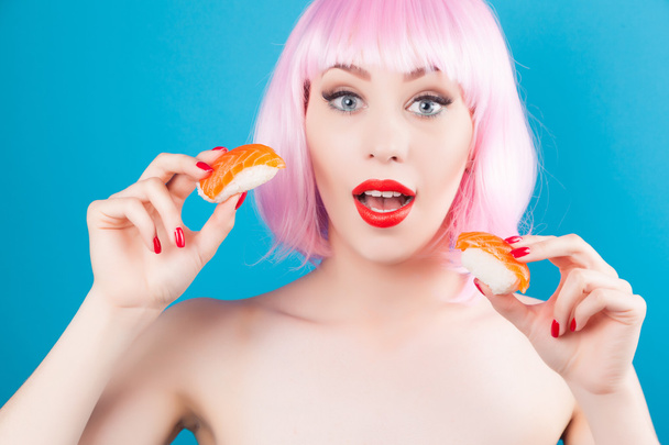 Beautiful girl eating sushi  - Fotografie, Obrázek