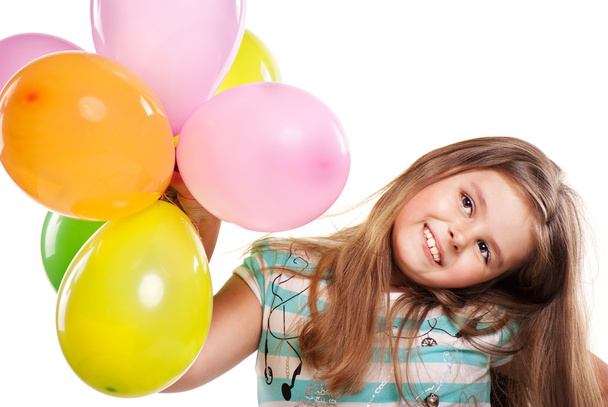 Little girl with balloons on a white background - Foto, Imagen