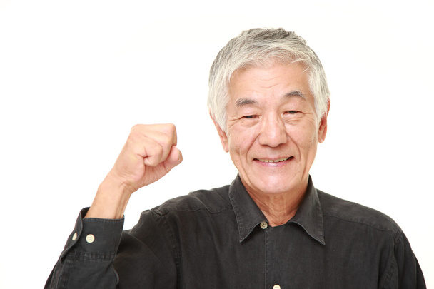 senior Japanese man in a victory pose - Фото, изображение
