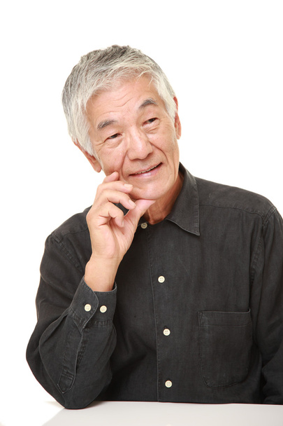 senior Japanese man thinks about something  - Фото, изображение