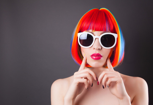 beautiful woman wearing colorful wig - Foto, Imagem