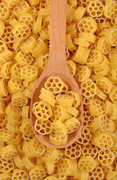 Uncooked italian pasta rotelle in a spoon - Photo, Image