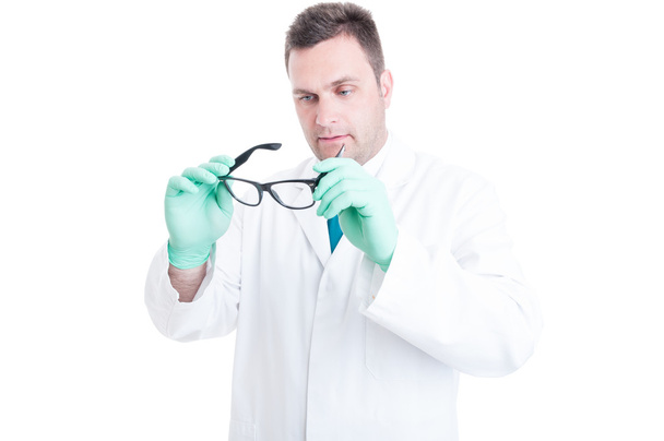 Male scientist preparing and looking at his glasses - Photo, Image