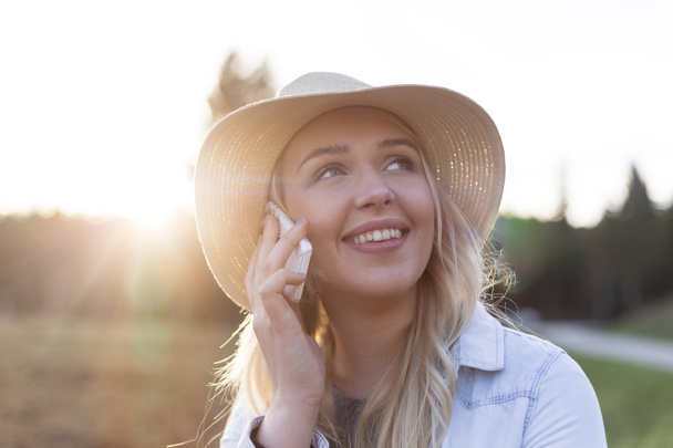 young smiling girl talking on phone - Photo, image