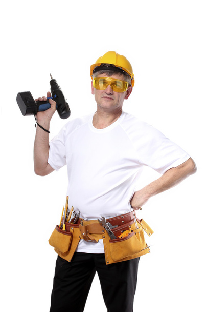 Builder with belt construction and holding drill isolated on white - Foto, Imagem
