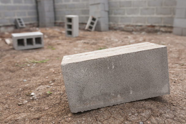 Stack of cement blocks at the construction site. cinder blocks background. - Photo, Image