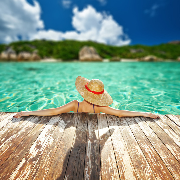 Woman in hat relaxing at beach - Photo, Image