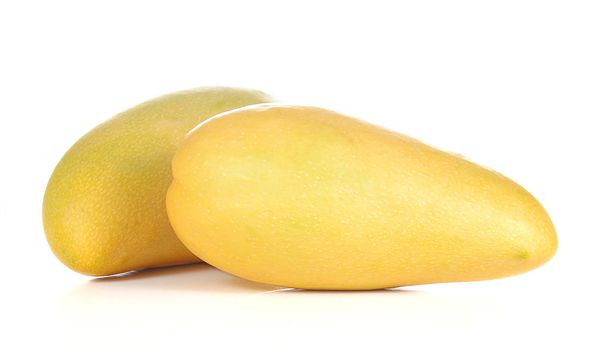 Two yellow mango on white background. - Foto, Imagem