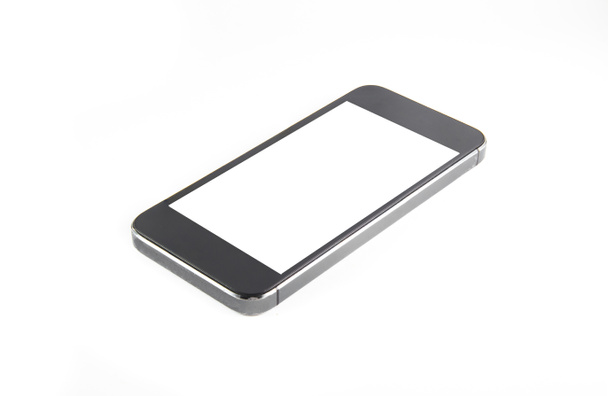 Negro teléfono inteligente moderno con pantalla en blanco se encuentra en la superficie, aislado sobre fondo blanco. Toda la imagen en foco, de alta calidad
. - Foto, Imagen