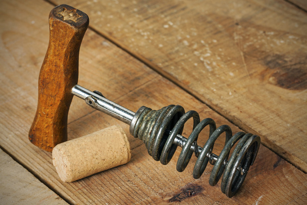 a vintage corkscrew with wood background - Photo, Image