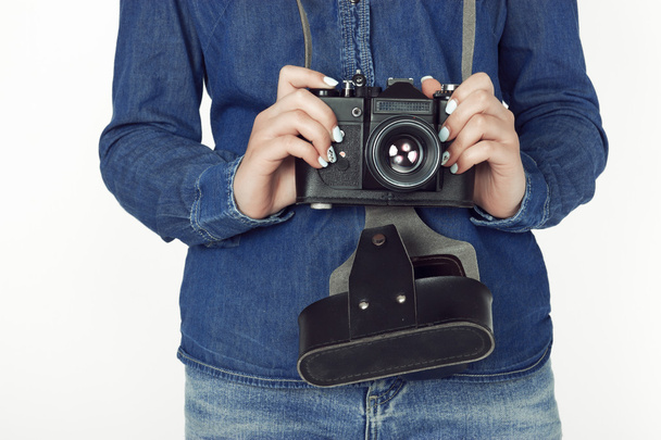 Young woman holding an old vintage camera - Foto, Bild