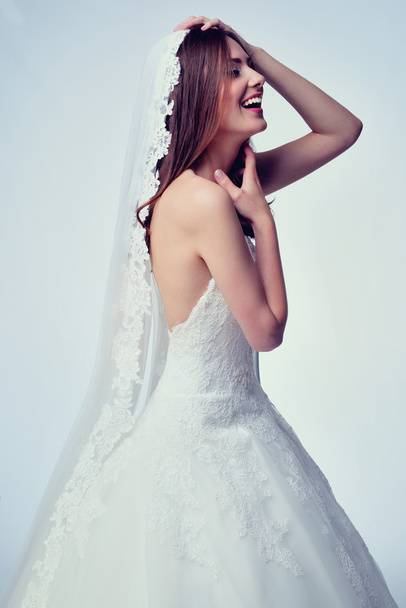 Beauty woman with wedding hairstyle and makeup. Bride fashion. Woman in white dress. - Foto, afbeelding