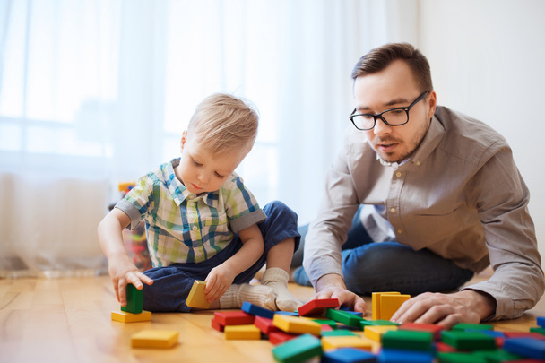 father and son playing with toy blocks  - Photo, Image