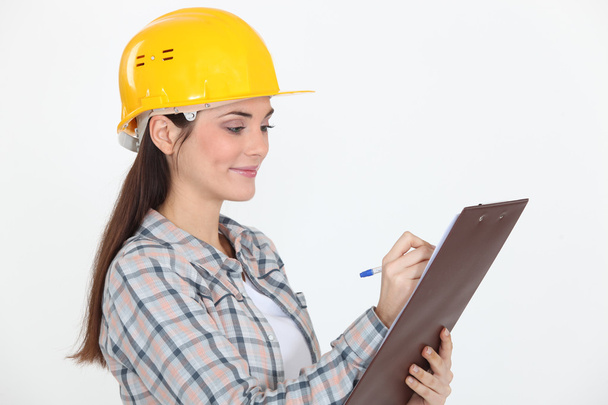 trabajador de la construcción con un portapapeles - Foto, imagen