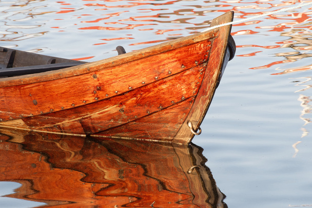 Closeup of wooden rowboat in warm evening light - Photo, Image
