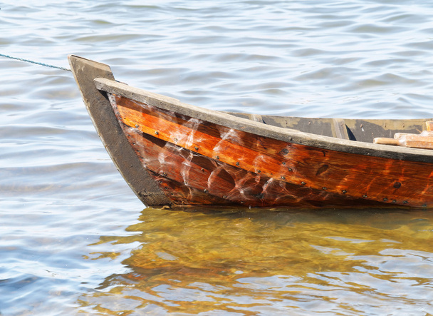 Closeup of wooden rowboat in warm evening light - Photo, Image