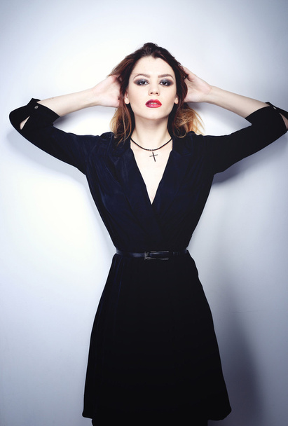 Portrait of beautiful brunette woman in black dress. Fashion photo - Valokuva, kuva