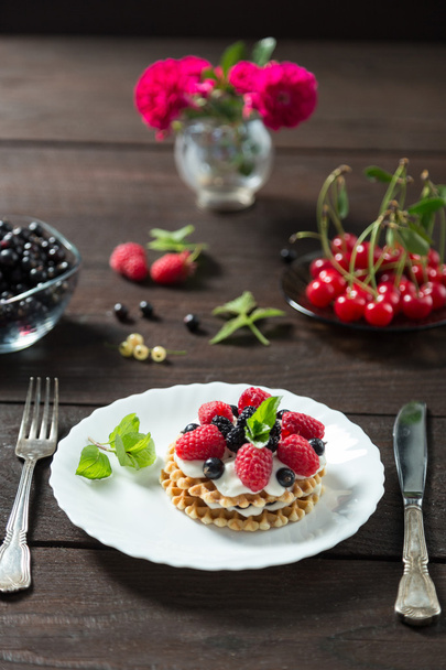 berry cake on a white plate - Photo, image