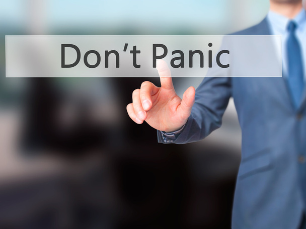 Don't Panic - Businessman hand pressing button on touch screen i - Photo, Image