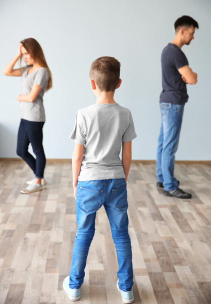 Family problems concept. Boy looking on abusing parents - Fotó, kép