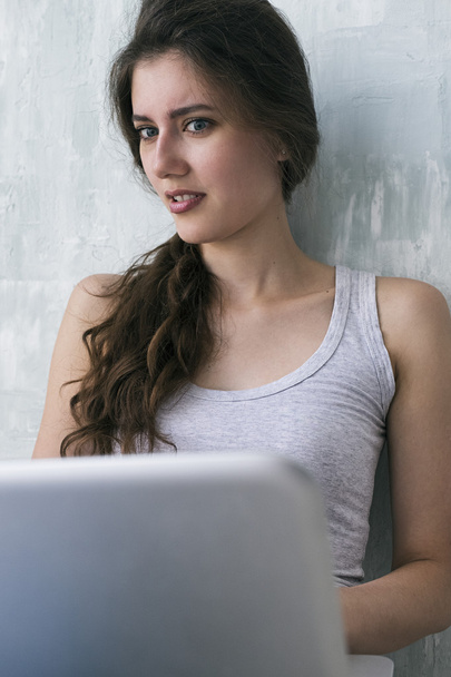 Close-up of shocked woman looking at laptop - Photo, Image