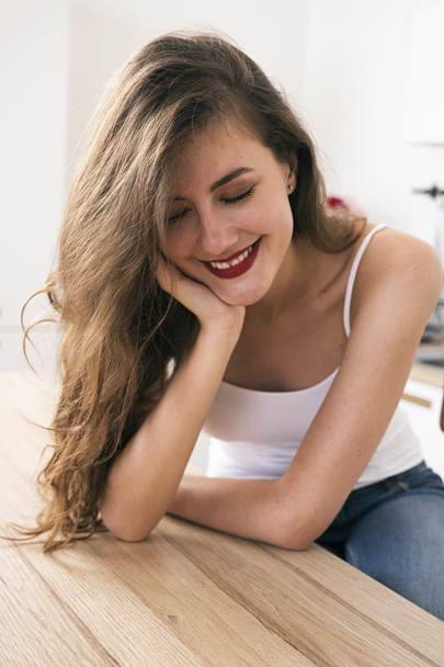 Smiling young brunette with red lips - Foto, afbeelding