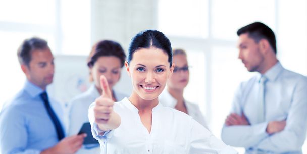 businesswoman in office showing thumb up - Photo, Image