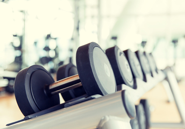 close up of dumbbells in gym - Foto, afbeelding